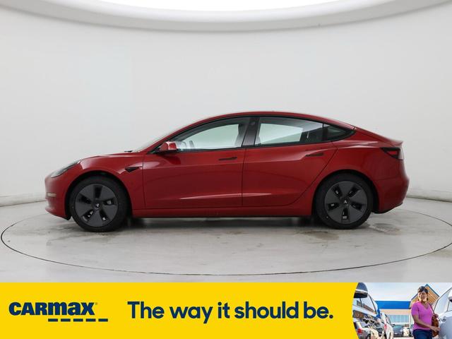 Photo of 2021 Burgundy Tesla Model 3