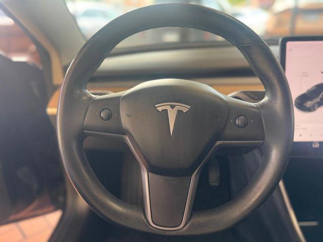 Photo of 2018 Black Tesla Model 3