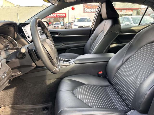 Photo of 2023 Midnight Black Metallic Toyota Camry