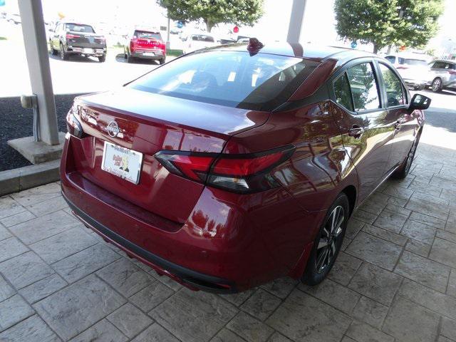 Photo of 2025 Scarlet Ember Tintcoat Nissan Versa