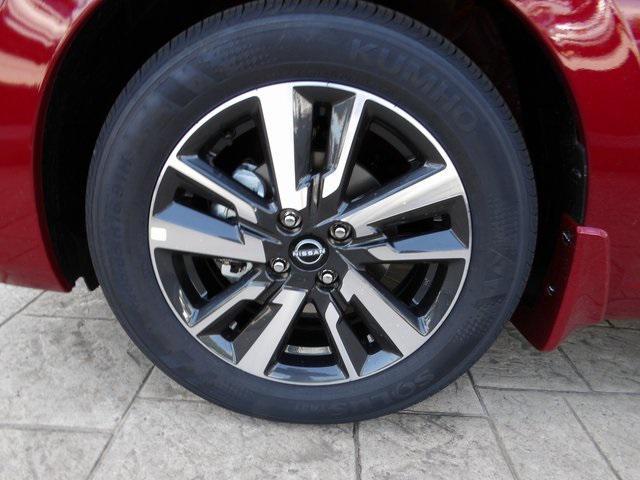 Photo of 2025 Scarlet Ember Tintcoat Nissan Versa