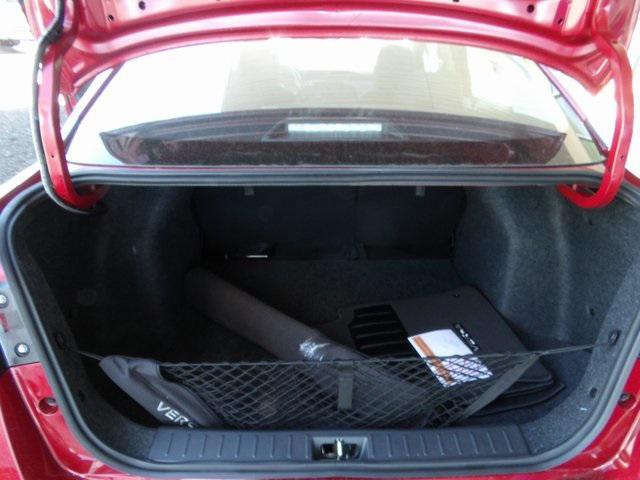 Photo of 2025 Scarlet Ember Tintcoat Nissan Versa