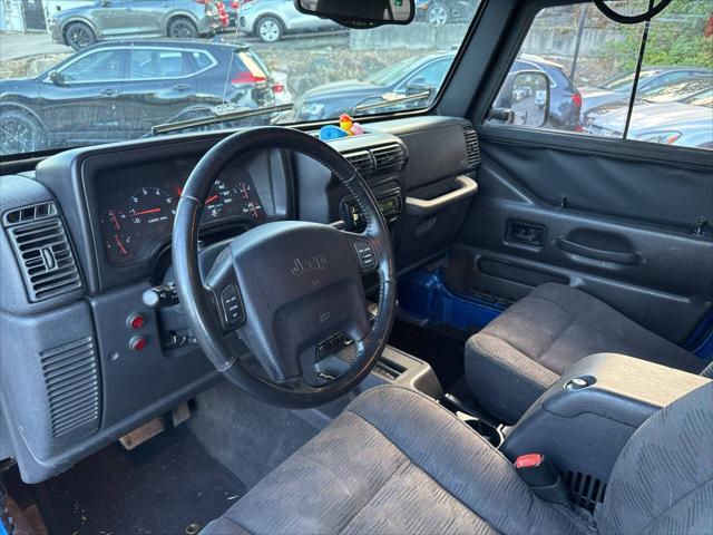 Photo of 2003 Blue Jeep Wrangler