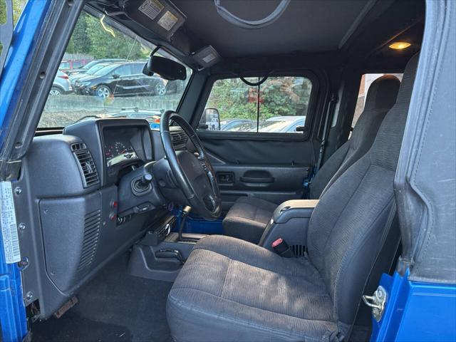 Photo of 2003 Blue Jeep Wrangler