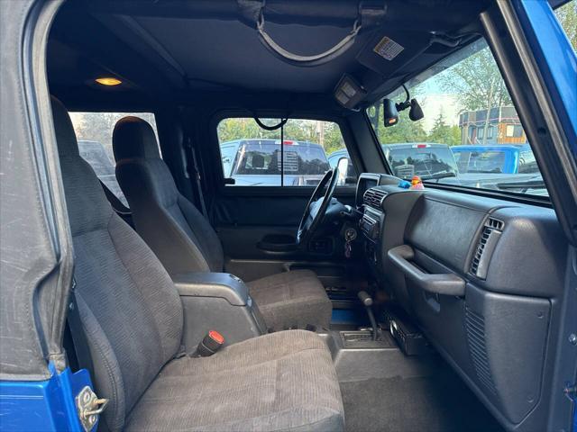 Photo of 2003 Blue Jeep Wrangler
