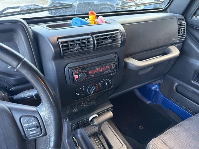 Photo of 2003 Blue Jeep Wrangler