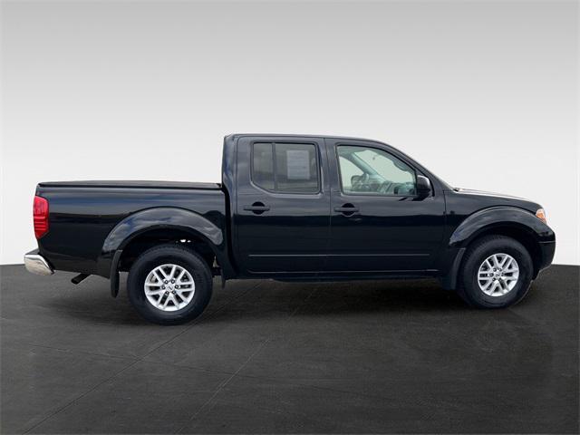 Photo of 2021 Magnetic Black Pearl Nissan Frontier