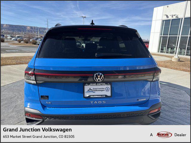 Photo of 2025 Cornflower Blue W/Black Roof Volkswagen Taos