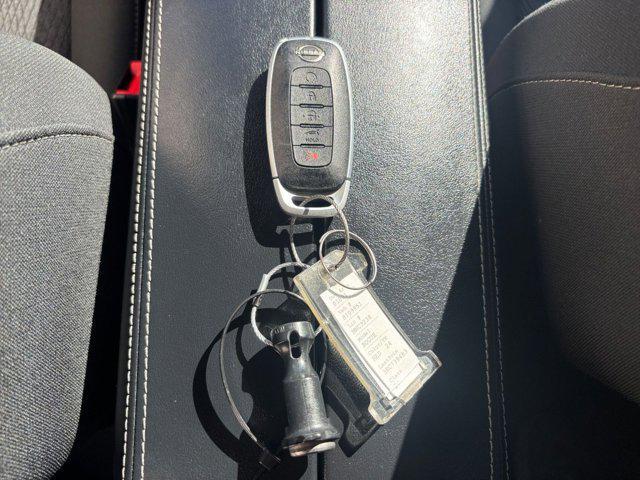 Photo of 2024 Scarlet Ember Tintcoat Nissan Rogue