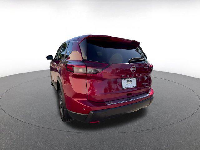 Photo of 2024 Scarlet Ember Tintcoat Nissan Rogue