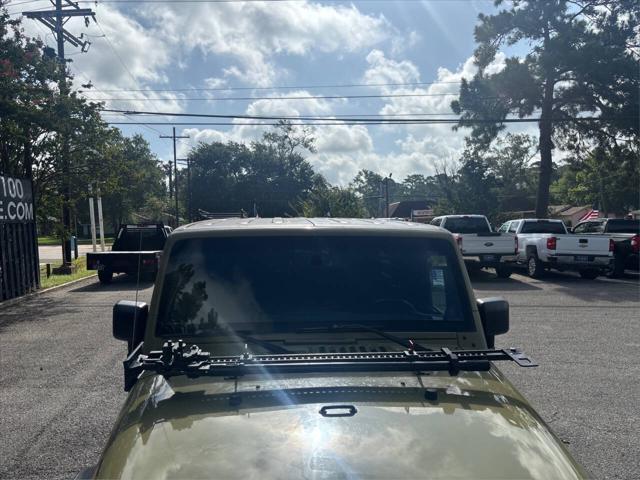 Photo of 2013 Commando Green Jeep Wrangler Unlimited