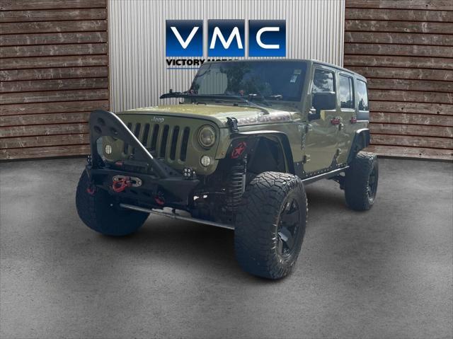 Photo of 2013 Commando Green Jeep Wrangler Unlimited