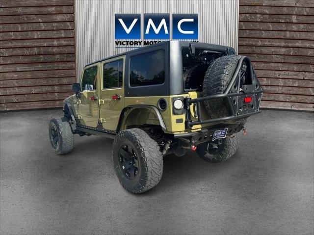 Photo of 2013 Commando Green Jeep Wrangler Unlimited