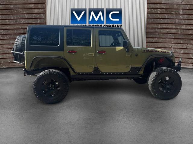 Photo of 2013 Commando Green Jeep Wrangler Unlimited