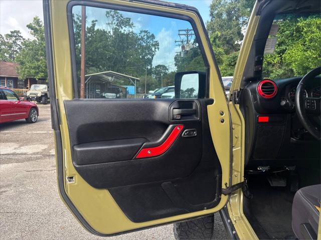 Photo of 2013 Commando Green Jeep Wrangler Unlimited