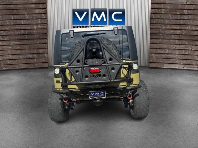 Photo of 2013 Commando Green Jeep Wrangler Unlimited