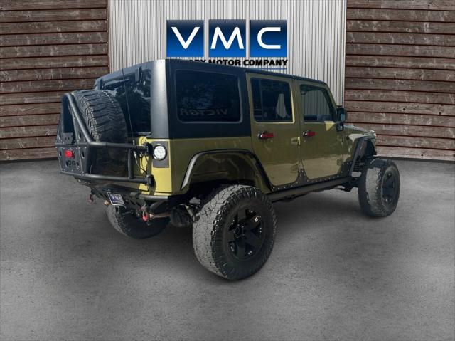 Photo of 2013 Commando Green Jeep Wrangler Unlimited