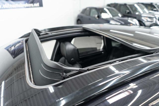 Photo of 2023 Jet Black Metallic Porsche Macan