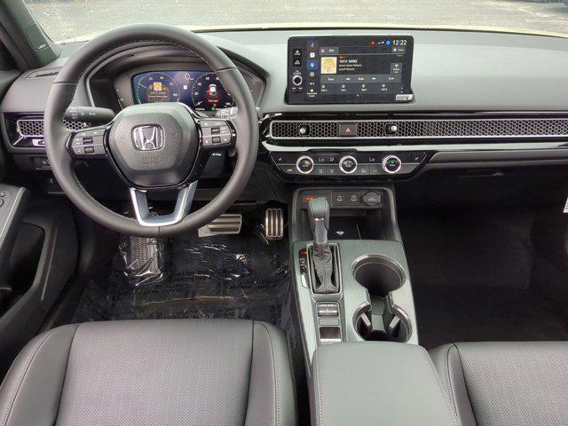 Photo of 2025 Sand Dune Pearl Honda Civic Hybrid