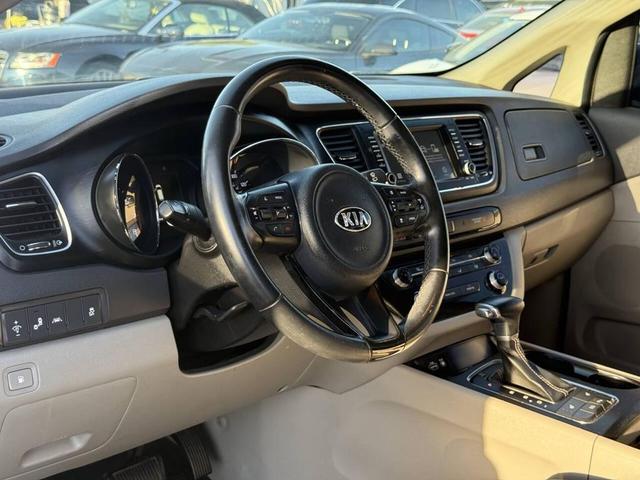 Photo of 2017 Aurora Black Kia Sedona