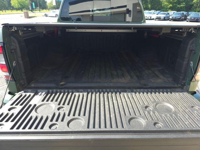 Photo of 2023 Tactical Green Metallic Nissan Frontier