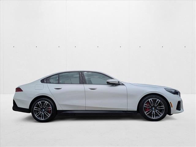 Photo of 2026 Mineral White Metallic BMW 550e