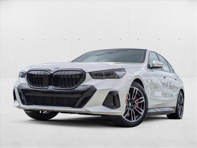 Photo of 2026 Mineral White Metallic BMW 550e
