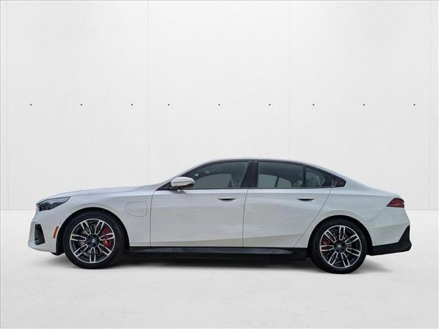Photo of 2026 Mineral White Metallic BMW 550e