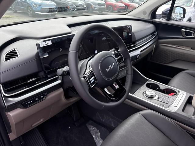 Photo of 2026 Deep Chroma Blue Kia Carnival Hybrid