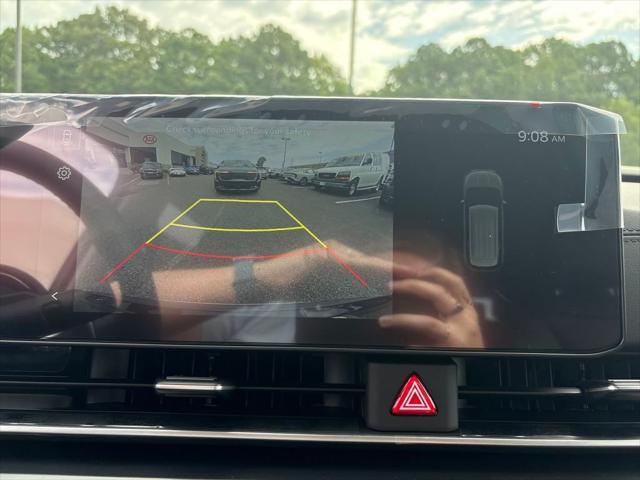 Photo of 2026 Deep Chroma Blue Kia Carnival Hybrid