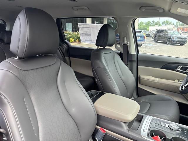 Photo of 2026 Deep Chroma Blue Kia Carnival Hybrid