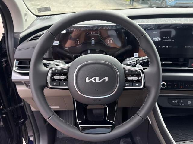 Photo of 2026 Deep Chroma Blue Kia Carnival Hybrid