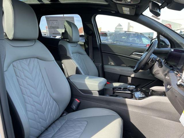 Photo of 2025 Jungle Green Kia Sportage