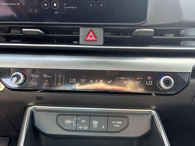 Photo of 2025 Aurora Blue Kia Carnival Hybrid