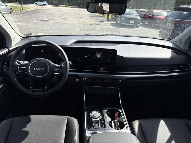 Photo of 2025 Aurora Blue Kia Carnival Hybrid