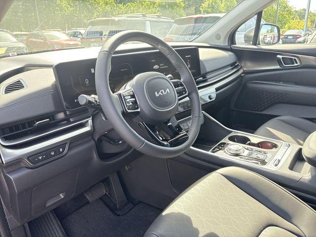 Photo of 2025 Aurora Blue Kia Carnival Hybrid