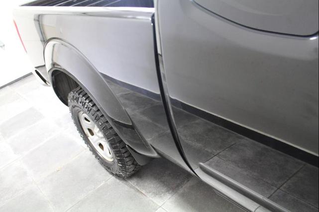 Photo of 2015 Super Black Nissan Frontier