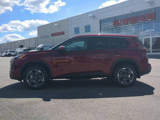 Photo of 2026 Scarlet Ember Tintcoat Nissan Rogue