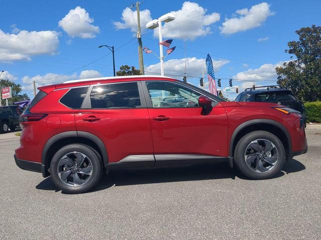 Photo of 2026 Scarlet Ember Tintcoat Nissan Rogue