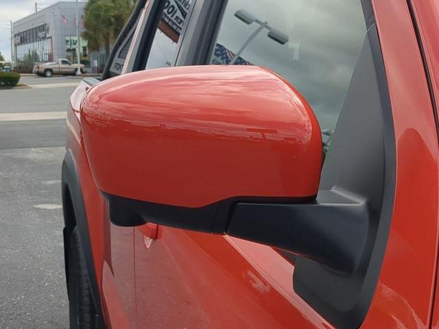 Photo of 2025 Afterburn Orange Nissan Frontier