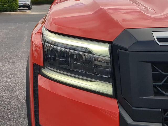 Photo of 2025 Afterburn Orange Nissan Frontier
