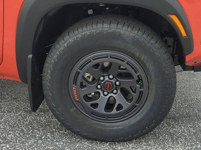 Photo of 2025 Afterburn Orange Nissan Frontier