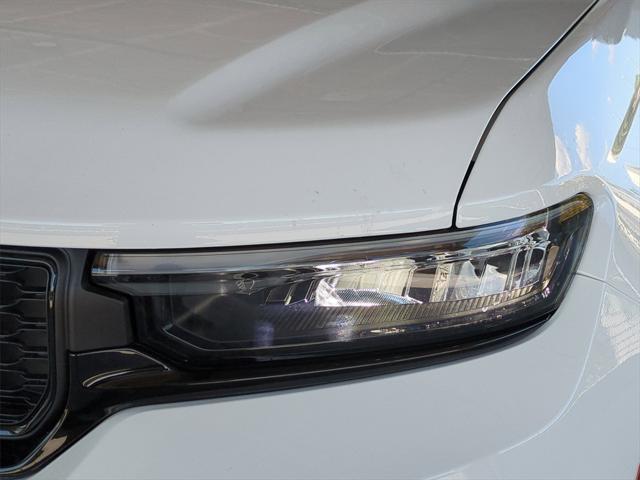 Photo of 2025 Bright White Clearcoat Jeep Grand Cherokee
