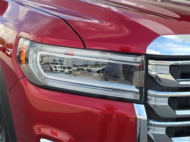 Photo of 2023 Volcanic Red Tintcoat GMC Acadia