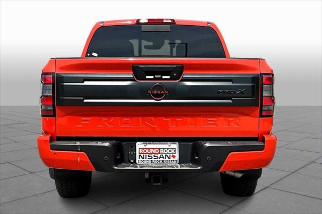 Photo of 2025 Afterburn Orange Nissan Frontier