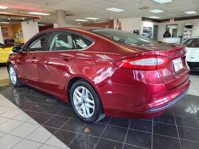 Photo of 2014 Ruby Red Metallic Tinted Clearcoat Ford Fusion
