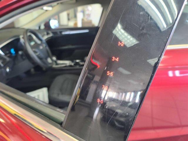 Photo of 2014 Ruby Red Metallic Tinted Clearcoat Ford Fusion