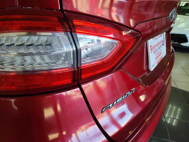 Photo of 2014 Ruby Red Metallic Tinted Clearcoat Ford Fusion