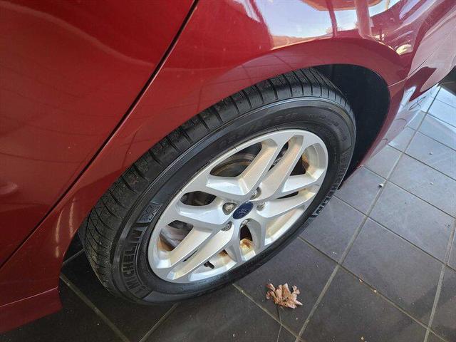 Photo of 2014 Ruby Red Metallic Tinted Clearcoat Ford Fusion