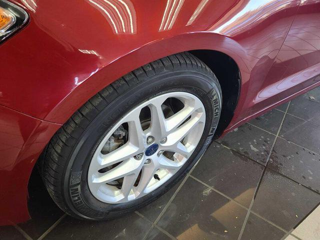 Photo of 2014 Ruby Red Metallic Tinted Clearcoat Ford Fusion
